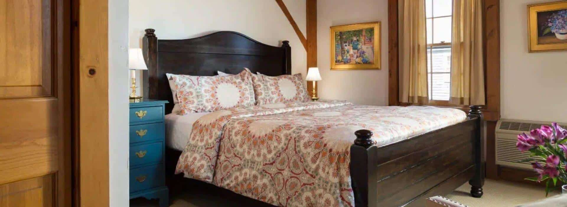 King bed in a Main House suite at Seven Sea Street Inn on Nantucket.