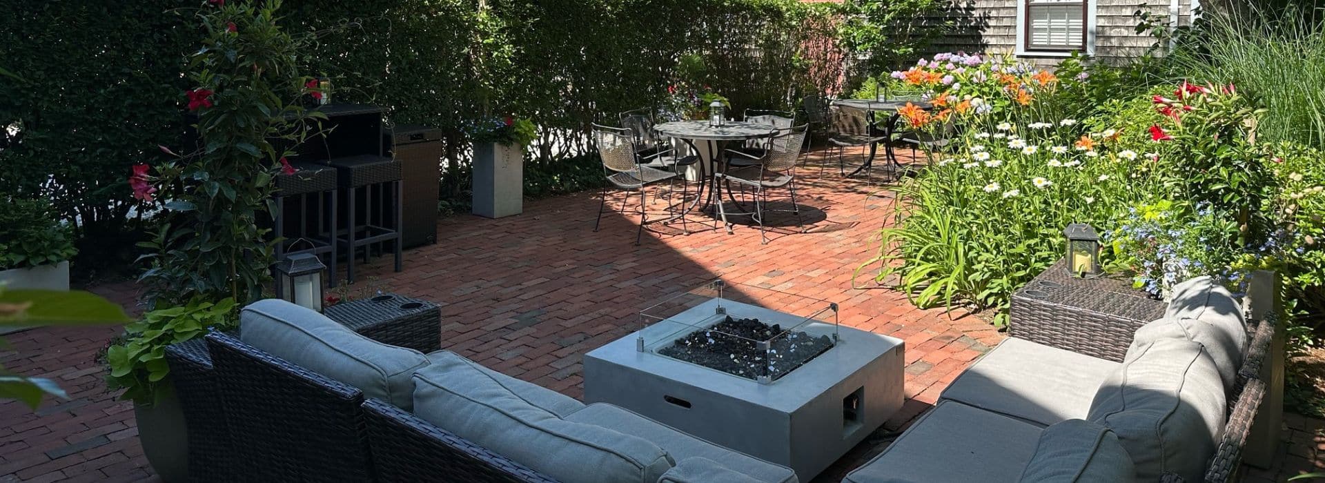 Guests can relax in the garden patio at Seven Sea Street Inn