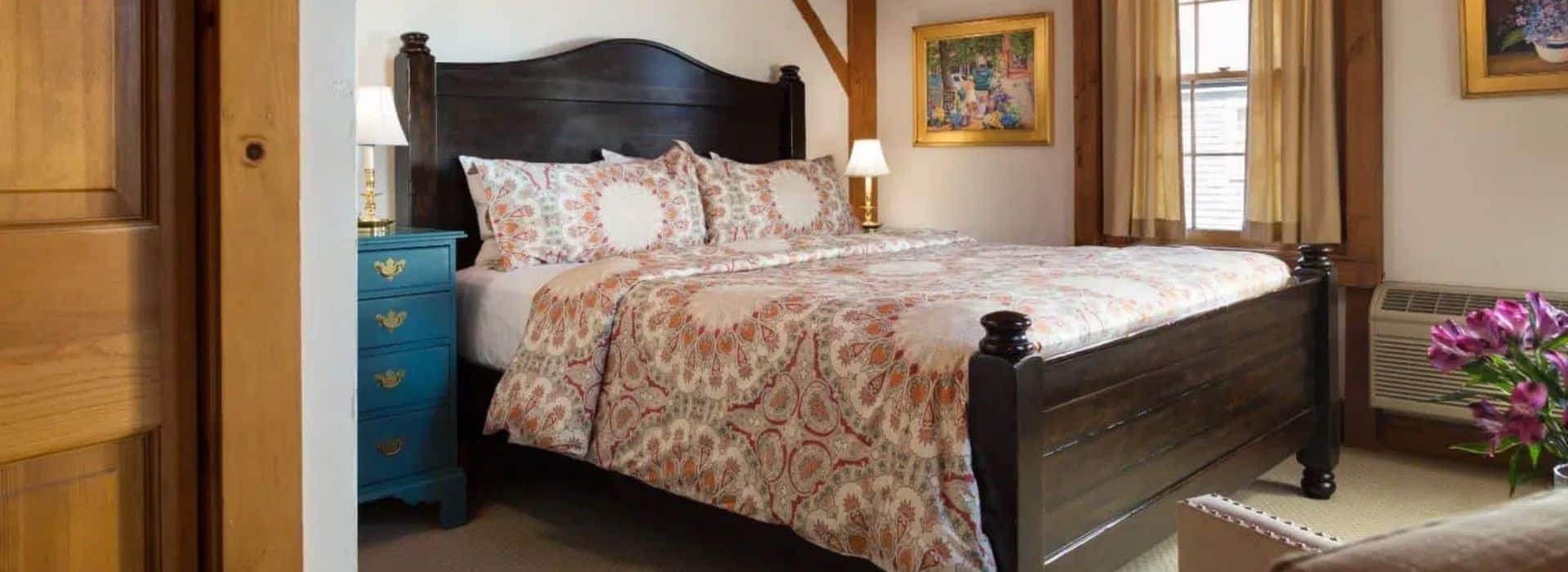 king bed in king room at seven sea street inn