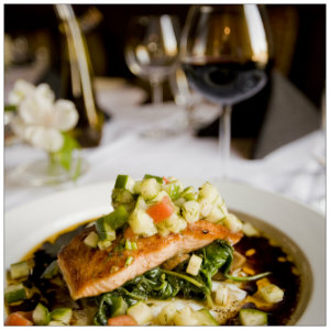 Gourmet plate of salmon with glass of red wine - photo by Casey Lee on Unsplash